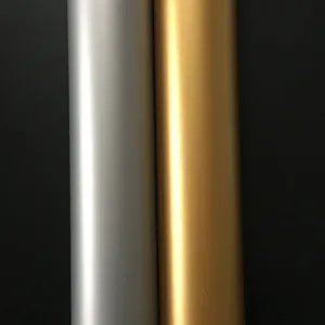 Close up detail view of metallic finish adhesive vinyl rolls in silver and gold color options.