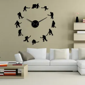DIY ice hockey wall clock with acrylic mirror silhouettes, perfect for modern living room decor.