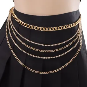 Close-up detail of multi-layered gold waist chain with rhinestones, stylish body jewelry accessory.
