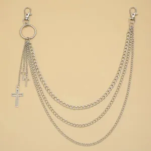 Detailed view of punk multi-layer metal pants chain with cross pendant and secure lobster clasps.