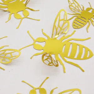 Close-up detail of 3d gold hollow bee wall stickers for home decor party 12pcs