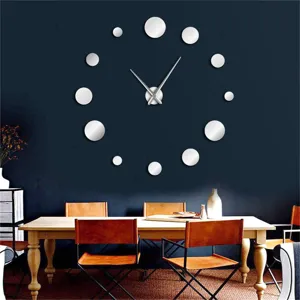 Detailed view of large DIY 3D mirror wall clock with round dot numbers on dark wall.
