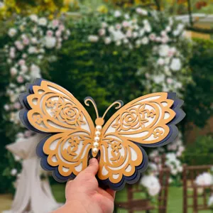 Detail view of 3D pearl hollow butterfly wall sticker, layered paper craft for wedding decor.