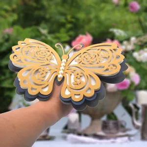 Detail view of 3D layered hollow butterfly wall sticker, showing gold cutouts and pearl body.