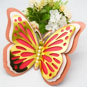 3D layered hollow out butterfly wall sticker with gold foil glitter and pearl accents detail.