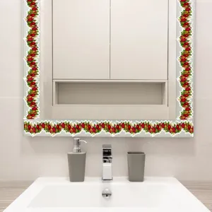 Christmas garland wall sticker detail showing festive red baubles and green leaves decor.