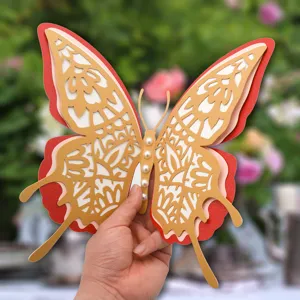 Close-up of 3D hollow butterfly wall sticker with multi-layer pearl design for decor.