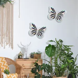 Detail view of 3d hollow pearl butterfly wall stickers in a cozy home decor setting with green plants.