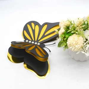3D layered hollow butterfly wall sticker with pearls, black and gold decor for parties.
