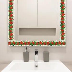 Detailed view of Christmas poinsettia vine wall sticker decorating bathroom mirror festively.