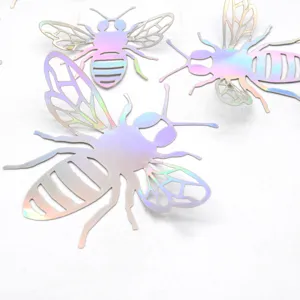 Close up detail of 3D hollow holographic bee wall stickers with shiny iridescent finish.