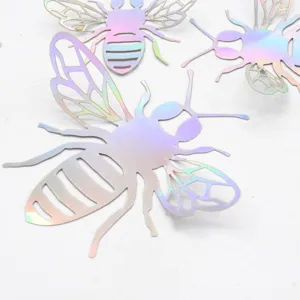 Close-up detail of 3D hollow holographic bee wall stickers, laser cut shimmering design.