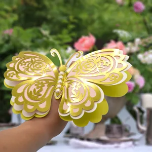 Beautiful 3D layered hollow butterfly wall stickers with pearls for home and wedding decor.