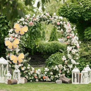 Detailed view of 3D layered hollow butterfly wall stickers decorating a scenic floral arch.