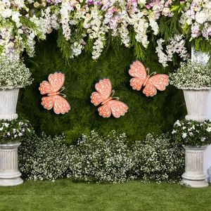 Detailed scene view of 3D hollow butterfly wall stickers with pearls for wedding decor.