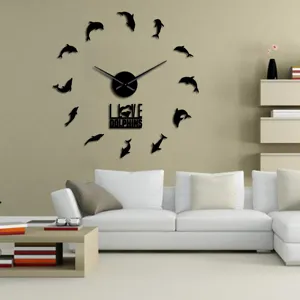 Living room wall clock detail view, modern acrylic design with dolphin markers, stylish decor.
