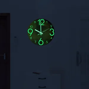 Detailed view of 3D luminous Mars wall clock in the dark, silent acrylic decorative clock.