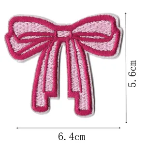 Pink bow embroidery patch detail, exquisite stitching for apparel and hair clip decor.