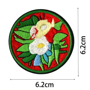 Round embroidered patch with floral design, ideal for jackets and backpacks decoration.