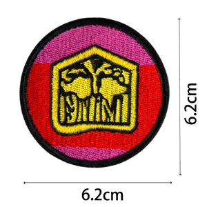 Round embroidered patch with bright red pink border and yellow central emblem design detail.