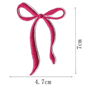 Pink ribbon bow embroidery patch detail view showing height and width dimensions clearly.