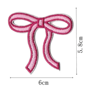 Pink bow embroidery patch for DIY hair accessories, cute garment decoration and craft supplies.