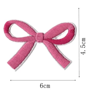 Pink bow embroidery patch DIY accessory, cute fabric applique for clothing and hair clips.