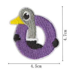 Detailed close-up of a creative animal embroidered patch showing fine stitching and colors.