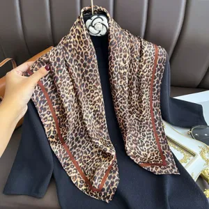 Elegant leopard print square scarf with rich brown border for women chic fashion wear.