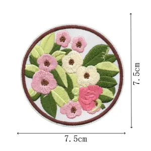 Detail view of the round embroidered floral patch, showing fine stitching and clear dimensions.