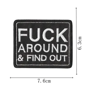 Tactile embroidered patch with bold slogan text, durable fabric badge for apparel backpacks.