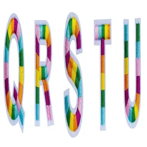 Close-up detail of colorful striped embroidered alphabet letter patches Q R S T U DIY decor.