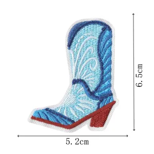 Blue cowboy boot embroidery patch, detailed stitched design, clothing DIY accessory item.
