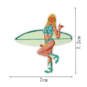 Embroidered surfer girl patch with surfboard, detailed fabric applique for clothing and bags.