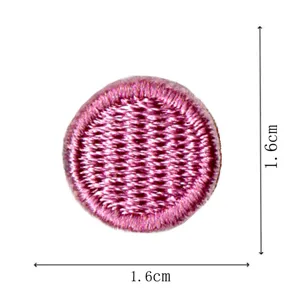 Pink round embroidered patch badge appliques with fine stitching for DIY clothes repair.