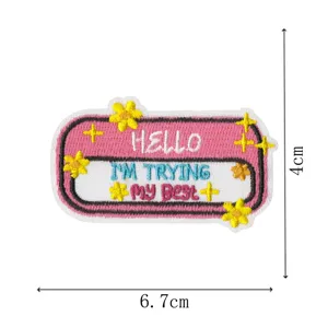 Detailed view of a cute decorative embroidery patch featuring English text and vibrant colors.