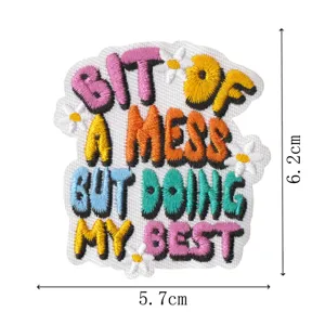 Close-up detail of embroidered phrase patch with colorful lettering, perfect for DIY jackets.
