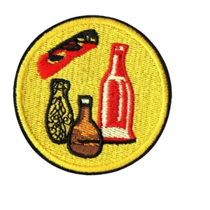 Round embroidered patch with artistic bottle and bird patterns, ideal for clothing and bags.