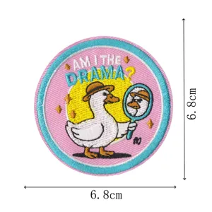 Cute round embroidered duck patch with mirror design, perfect for jackets and bags.