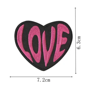 Black heart embroidery patch with pink LOVE text, iron-on decorative clothing badge main view.