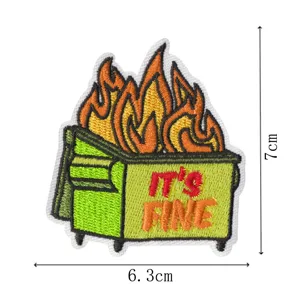 Detailed view of dumpster fire embroidered patch with text, showing fine stitching and size.