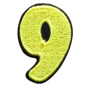 Close-up detail of a yellow embroidered number nine patch with black border for clothing DIY.