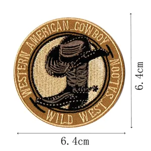 Close-up detail of western cowboy embroidered patch with hat and boots design, 6.4cm size