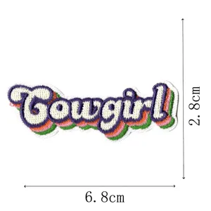 Close-up detail of the colorful embroidered cowgirl letter patch with clear dimension marks.