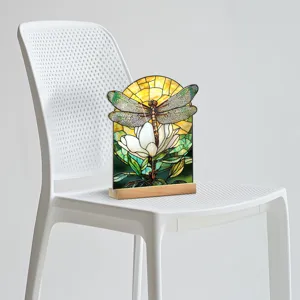Stained glass style dragonfly acrylic ornament detail shot, floral pattern with wood base.