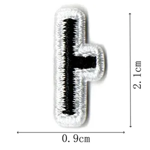 Embroidered letter patch detail view, black and white design, size 2.1x0.9cm for garments.