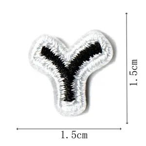 Black and white embroidered letter Y patch detail shot showing 1.5cm size and clean stitching.