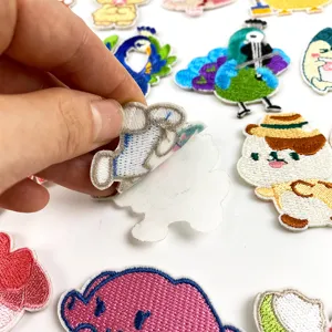 Self-adhesive cute embroidered cartoon cloth patches for phone cases, clothes, and tablets.