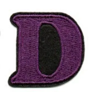 Close-up of purple alphabet letter D embroidery patch detail showing neat stitching texture.
