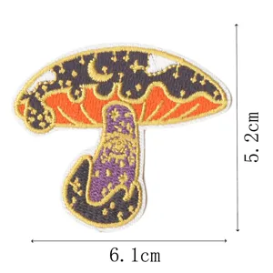 Detailed view of mystical mushroom embroidered patch with celestial moon pattern, 6.1x5.2cm.